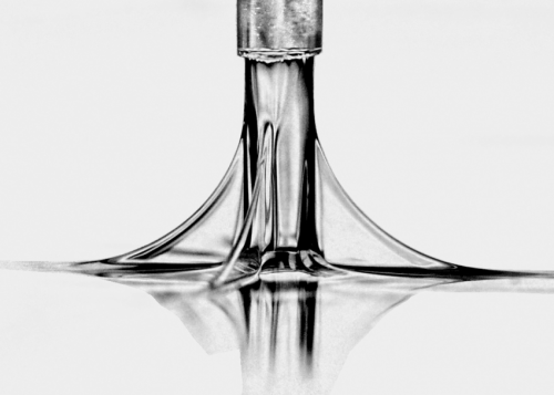 A viscoelastic fluid stretching beneath a cylindrical tool